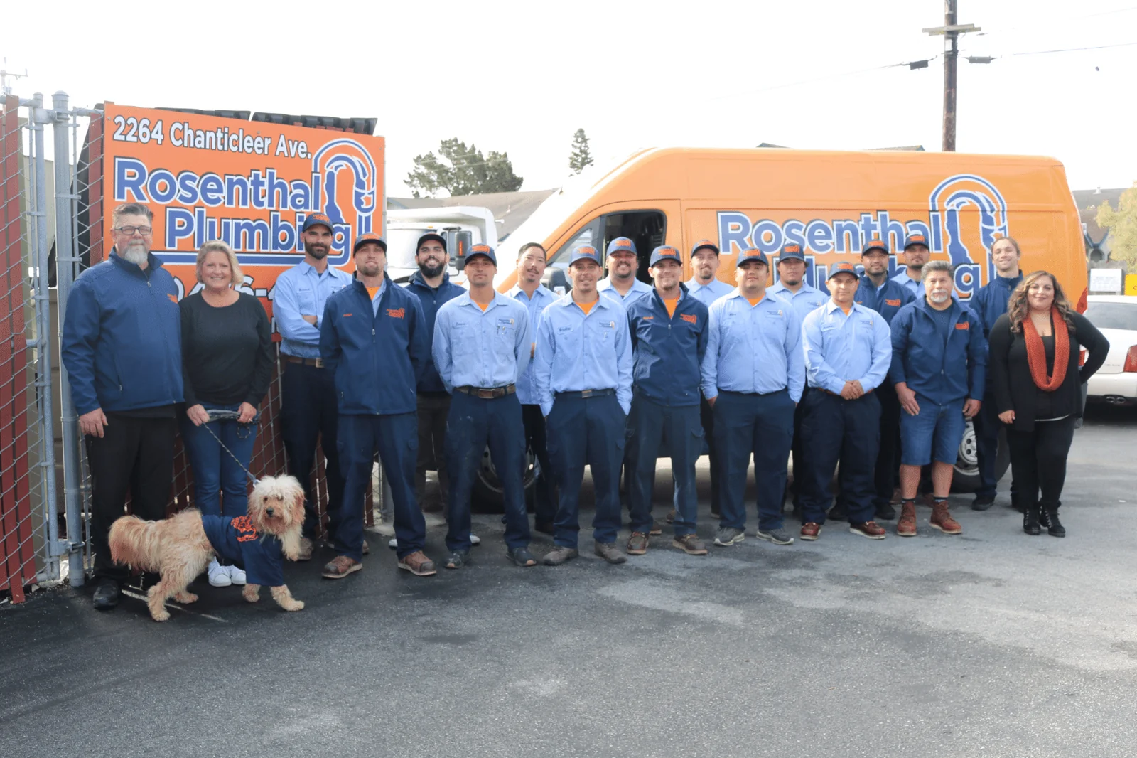 The Rosenthal Plumbing team in front of their service trucks